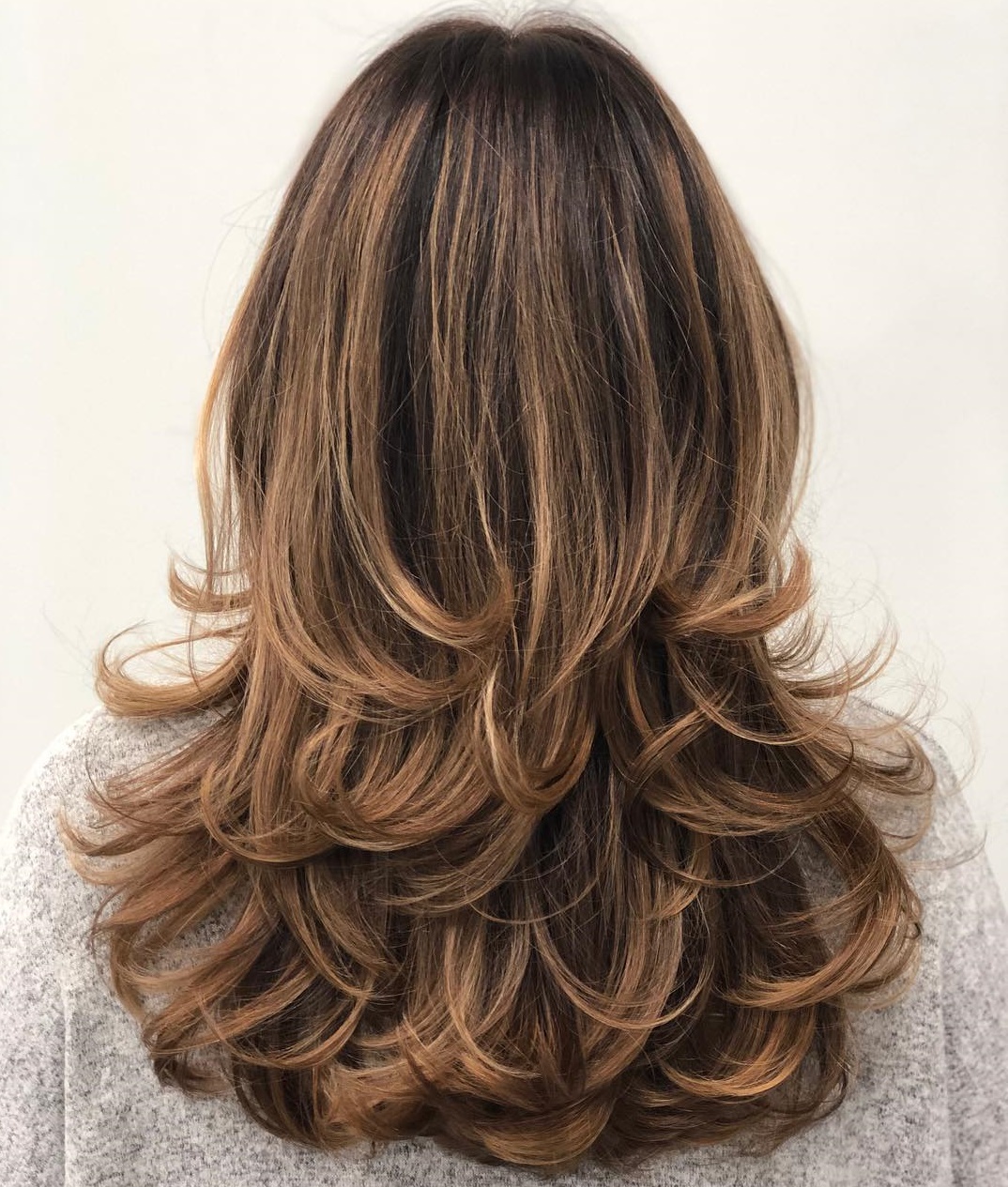 Wavy Lengths with Soft Blend U-Cut Layers and Black Color - The Latest  Hairstyles for Men and Women (2020) - Hairstyleology